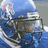 Blue background with white text and a pixelated football helmet image; text announces a college football game between Memphis Tigers and Arkansas.