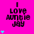 Bright pink background with black text reading "I LOVE AUNTIE JAY" and cyan plus signs in a pattern