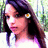 Pixelated static image of a person with long dark hair, light skin tone, and an earring featuring orange and white colors.
