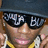 Pixelated image of a person wearing dark sunglasses with 'soulja boy' text on lenses, a dark cap, and yellow clothing against white background.