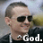 Pixelated image of a person wearing dark sunglasses and a black jacket with white text reading 'God.'