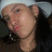 A pixelated image of a person with long dark hair and light-colored headwear on the left, next to red background text reading Besos, 4, You!