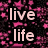 Pixelated text fragments in various colors on a black background with pink star-like patterns.