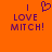Pixelated orange background with purple text reading "I LOVE MITCH!" and a heart symbol above the text on the left side.