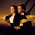 Animated pixel art of two figures in formal attire on a ship's deck with 'Titanic' text below, showing sequential movement against a sunset backdrop.