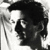 Static grayscale pixel art of a stylized human face with exaggerated features and high-contrast shading, rendered in 50x50 pixels on a white background.