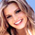 Static 50x50 pixel icon showing a close-up of a smiling person with light brown hair against a blue sky background, rendered in low-resolution pixel art style.