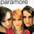 Three people in red tops pose closely together under 'paramore' text, with one person's head position shifting between frames.