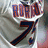 A baseball jersey with 'RODRIGUEZ' and number 7 in red and blue lettering on a gray background, shown from multiple angles.