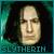 Pixelated portrait of a person with light skin and dark hair against a teal and dark green background, with text below the face.