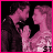Animated sequence of a couple kissing with changing text overlays in pink and white pixelated style.