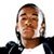 Static pixelated image of a person with short dark hair wearing a black jacket over a white shirt against a plain background.