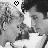 Black-and-white pixelated image of two figures in close proximity with a heart symbol above them, rendered in low-resolution style.