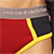 Red and black geometric shapes with yellow accents on a light background, partially cropped at top and right edges.