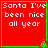 Red square with green border displaying white text "Santa I've been nice all year" and a small green pixelated tree in the bottom-right corner.