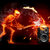A pixelated figure in orange and red tones appears to be performing a magic trick with a glowing wand against a dark background.
