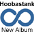 Blue infinity symbol with 'New Album' text and 'In Stores Nov 20!' announcement above website URL on white background.