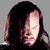 Static 50x50 pixel buddy icon showing a close-up of a person's face with long dark hair against a gray background, rendered in low-resolution pixel art style.