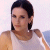 Static 50x50 pixel icon showing a person with dark hair in a white sleeveless top against a light background, rendered with low-resolution pixelation and dithering effects.