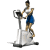A woman in a white top and blue shorts rides an elliptical trainer, captured across five showing motion progression