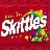 A 50x50 pixel animated buddy icon featuring a rainbow-colored character with the text "Snickles" on a red background and "taste the rainbow" in red text on white.