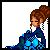Pixel art of a woman with brown braided hair in an updo, wearing blue and dark blue checkered dress, seated with hands clasped over lap.