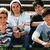 Group of people in light blue shirts and dark pants seated together, with text overlay reading "Not Like Them" on the right side.