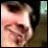 A pixelated contact sheet showing two frames of an animated icon with a close-up face on the left and text on the right.