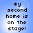 Blue background with pixelated text reading 'my second home is on the stage!' in four identical arranged in a