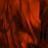 A static image with a red and black abstract pattern on the left, transitioning to solid light gray on the right.