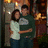 A pixelated image of two people embracing in a dimly lit indoor setting with warm lighting, next to three of the word 'Love' rendered as stylized text