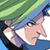 Pixelated anime-style character face with blue hair and green eyes, wearing a white shirt under dark clothing, partially obscured by green foliage against a light background.
