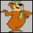 A pixelated cartoon bear in an orange jumpsuit with a green scarf and cap, standing next to green text reading "smarter than the average bear!" on a black background.