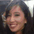 A person with long dark hair smiling in a of four , with a purple text overlay reading 'aileen' in the top-right