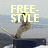 Pixelated animation of a skier performing tricks on a ramp with text overlays reading "FREE-STYLE" and "SKIING".