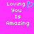 Pixelated text 'Loving You Is Amazing' on bright pink background with cyan heart symbol above 'Loving' on left side.