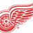 Red winged circular emblem with layered stripes and a central dot, displayed in a with one grayed-out section