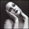 Four- black-and-white shows a person with dark hair and heavy makeup in sequential poses: hands resting on cheeks, then raised to temples, eyes wide open, mouth agape