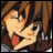 Anime-style character with brown hair and blue eyes, mouth open with tongue out, next to pixelated text on black background.
