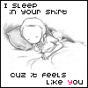 A black-and-white sketch of a figure sleeping on a pillow with text reading "I SLEEP IN YOUR SHIRT" and "CUZ IT FEELS LIKE YOU" where the final 'U' is red.