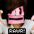 Pixelated character with brown hair and pink mask displays animated text and hand gestures against black background.