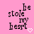 Pink background with black text reading 'be stole my heart' and a white pixelated heart symbol.