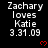 Pixelated text displays 'Zachary loves Katie 3.31.09' with red heart symbols on a black background, arranged in a pattern