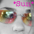 Pixelated close-up of two large eyes with multicolored irises and pink text reading 'GUN' above them on a gray background.