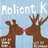 Pixelated reindeer kiss under light blue sky with text overlays on red and gray
