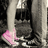 A pixelated static image shows a dark, tall structure with vertical lines and a pink curved shape at the bottom left.
