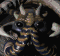 Animated sequence of a stylized dragon head with blue and gold stripes, black eyes, and white horns against a dark background.