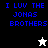 Pixelated blue text "I LUV THE JONAS BROTHERS" on black, white, and gray backgrounds with a small star icon changing from white to black.