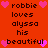 Red background with pixelated text and pink hearts arranged in a pattern, displaying repeated phrases
