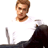 Pixelated static image of a person in a white shirt with dark hair and brown skin tone, partially cropped on the right side against a plain background.